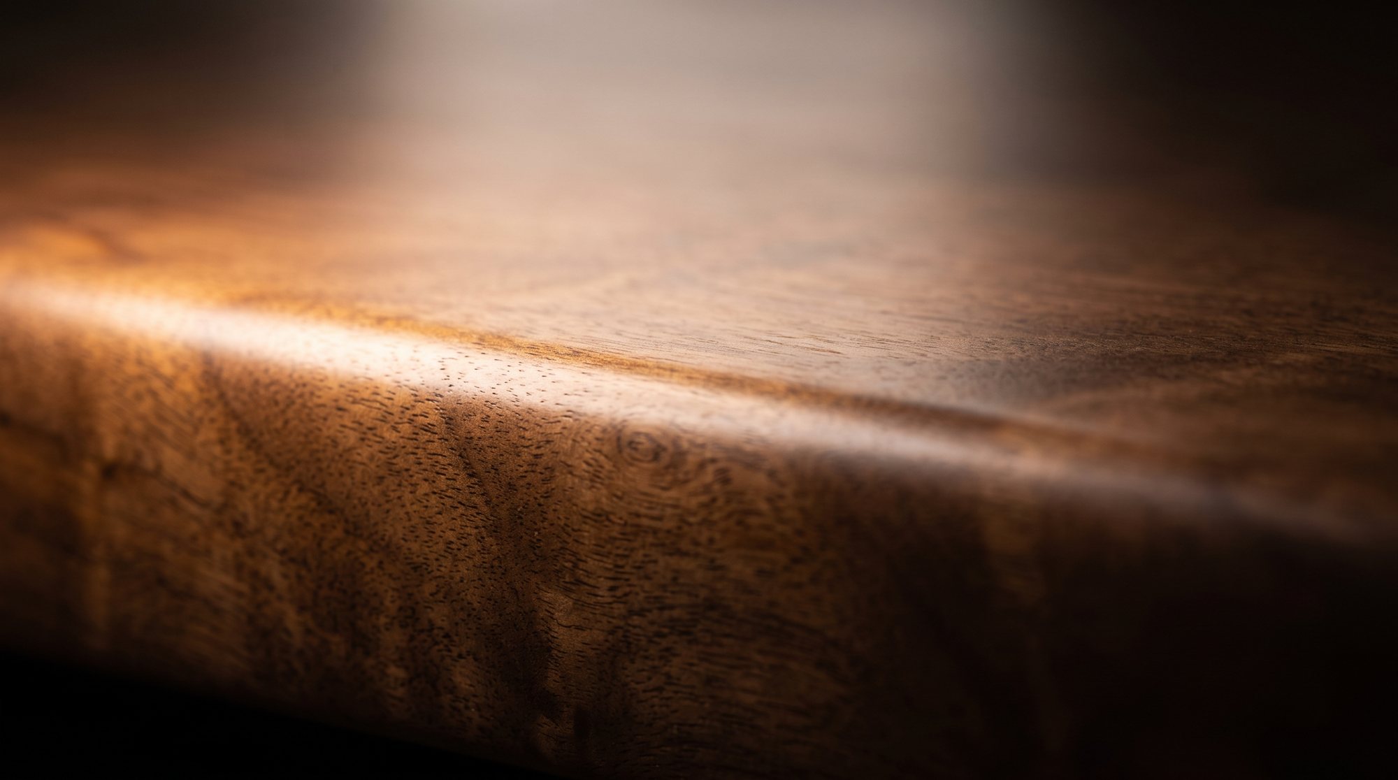 Close-up of a walnut veneer edge in warm light