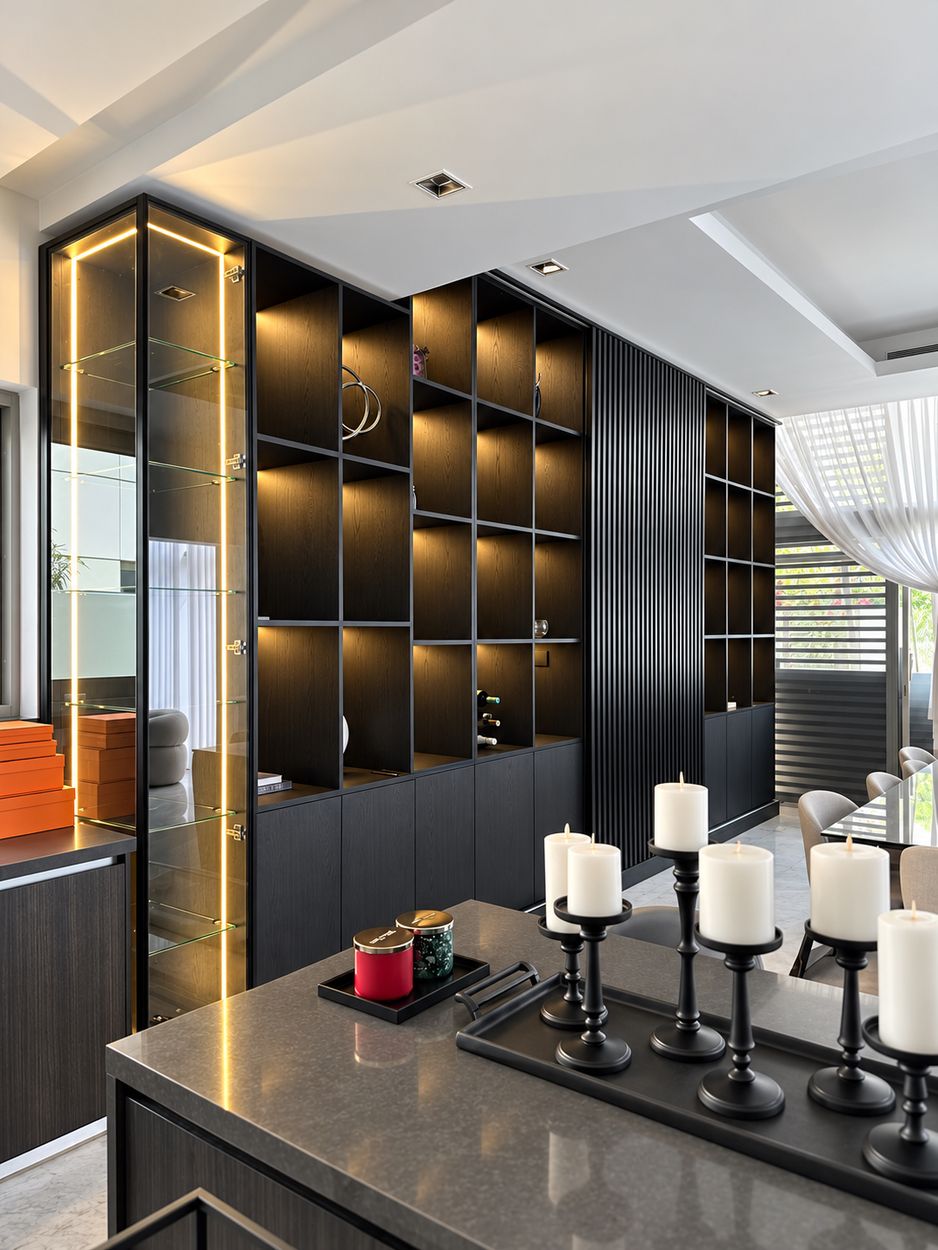 Black display wall with lit cubbies, glazed corner cabinet and base storage